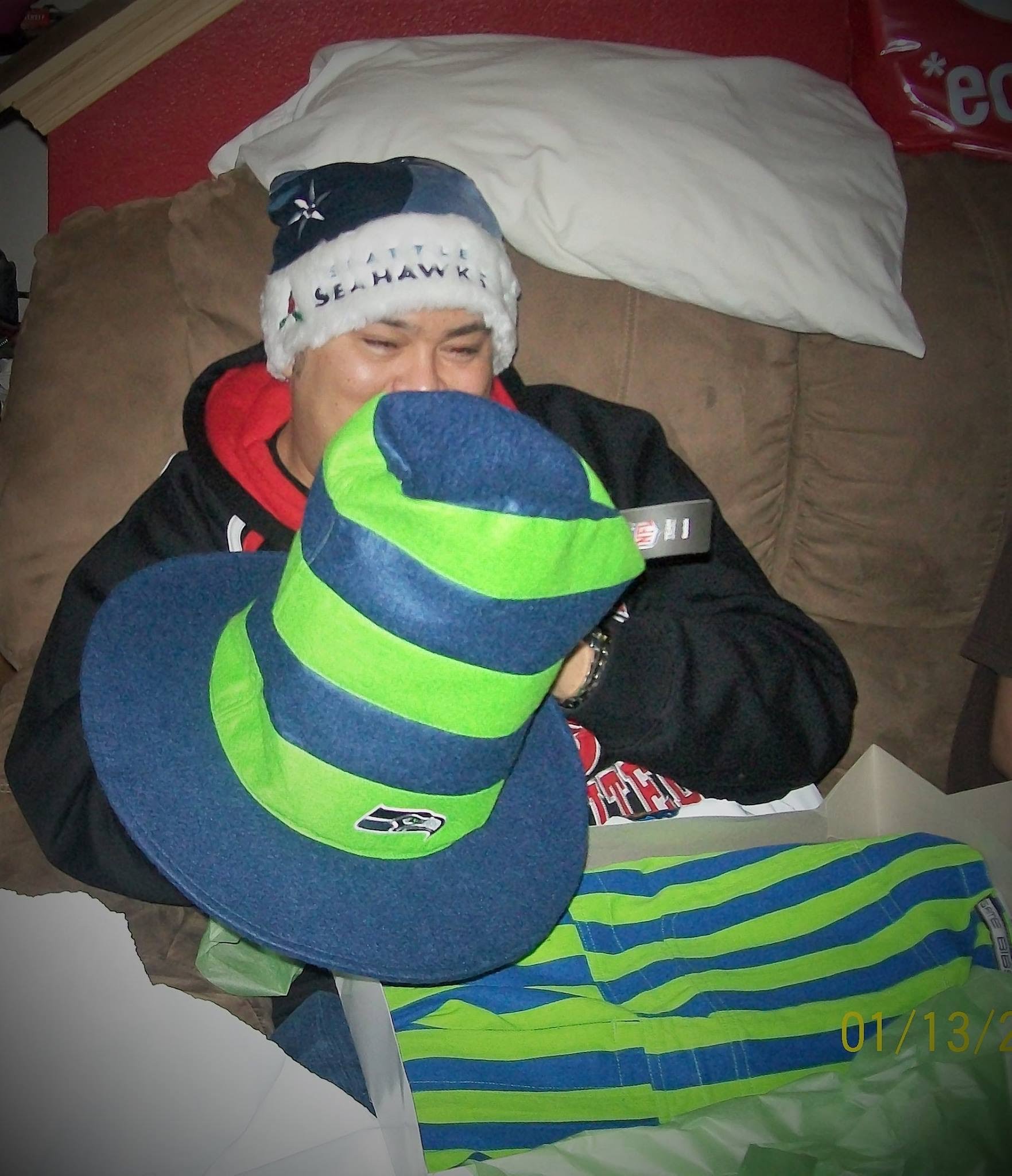 Christmas morning unboxing of striped overalls and tall hat